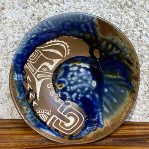 Porcelain bowl with Polynesian tattoos hand carved through brown slip into the porcelain clay