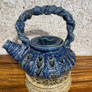 Teapot with fish design in relief with Japanese clay handle and clay in relief. This beautiful teapot is useful as well as decorative and is glazed in our Huahine blue and green. Contact us for a virtual visit to choose your own teapot as they are all very unique.